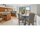 Breakfast nook in the kitchen near backyard access, island, and stainless steel appliances at 1502 Creekbend Dr, Brandon, FL 33510