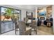 Breakfast nook near the living area with sliding glass doors to the backyard patio and pool at 1502 Creekbend Dr, Brandon, FL 33510