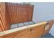 This backyard space has a dog wash area with a wooden fence and gray gravel at the ground at 1502 Creekbend Dr, Brandon, FL 33510