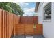 This backyard space has a charming dog wash area with a wooden fence and a 'Dog Wash' sign at 1502 Creekbend Dr, Brandon, FL 33510