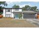 Charming two-story home showcasing a fresh exterior, well-maintained lawn, and inviting curb appeal at 1502 Creekbend Dr, Brandon, FL 33510