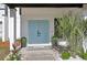 Stylish light blue double doors, enhanced by elegant landscaping, welcome you to this beautiful home at 1502 Creekbend Dr, Brandon, FL 33510