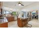 An open-concept kitchen with an island, wood cabinetry, and a breakfast nook at 1502 Creekbend Dr, Brandon, FL 33510