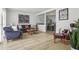 Open living room with hardwood floors, stylish décor, and seamless connection to the dining area at 1502 Creekbend Dr, Brandon, FL 33510