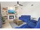 Inviting living room with a fireplace, built-in shelves, and comfortable seating for relaxation and entertainment at 1502 Creekbend Dr, Brandon, FL 33510