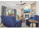 Cozy living room with fireplace, built-in shelving, and large windows offering great natural light at 1502 Creekbend Dr, Brandon, FL 33510