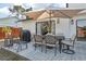 Outdoor patio features an umbrella-covered dining set and a grill, perfect for outdoor gatherings at 1502 Creekbend Dr, Brandon, FL 33510