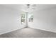 Bright carpeted bedroom features two windows for ample natural light at 1506 Lenton Rose Ct, Trinity, FL 34655