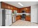 Well-equipped kitchen with stainless steel appliances, granite countertops, and ample cabinetry at 1506 Lenton Rose Ct, Trinity, FL 34655
