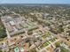 An aerial view shows this community near a shopping center with green lawns at 1510 Blue Sea St, Clearwater, FL 33756