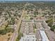 An aerial view showcases this well-maintained community, street access, and nearby shopping at 1510 Blue Sea St, Clearwater, FL 33756