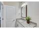 Bright bathroom featuring a granite vanity, modern fixtures, and a contemporary design at 1510 Blue Sea St, Clearwater, FL 33756