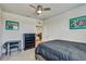 Comfortable bedroom featuring a work desk, dresser, and a glimpse into the bright and airy loft area at 1510 Blue Sea St, Clearwater, FL 33756