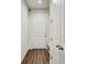 Entryway featuring hardwood floors and white trim offering a clean and modern look at 1510 Blue Sea St, Clearwater, FL 33756