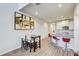 Open-concept kitchen with island, granite countertops and stainless appliances adjacent to dining area at 1510 Blue Sea St, Clearwater, FL 33756