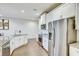 Modern kitchen with granite countertops, stainless steel appliances, and laminate wood flooring at 1510 Blue Sea St, Clearwater, FL 33756