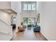 Bright living room with high ceilings, wood floors, comfortable seating, and sliding glass doors to outdoor space at 1510 Blue Sea St, Clearwater, FL 33756