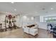 Bright open loft with a home gym, a comfortable sofa, and a functional desk space at 1510 Blue Sea St, Clearwater, FL 33756