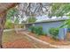 Backyard with brick paver patio, mature landscaping, and mulch at 1511 Meridel Ave, Tampa, FL 33612