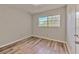 Bedroom with a window and wood-look flooring at 1511 Meridel Ave, Tampa, FL 33612