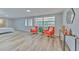 Large bedroom with two orange chairs, natural light and view of the bed at 1511 Meridel Ave, Tampa, FL 33612