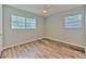 Bright bedroom features wood-look flooring and a ceiling fan at 1511 Meridel Ave, Tampa, FL 33612
