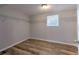 Walk-in closet with ample shelving space and wood-look flooring at 1511 Meridel Ave, Tampa, FL 33612