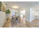 Inviting dining room with modern table set and view into kitchen and living area at 1511 Meridel Ave, Tampa, FL 33612