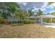 Charming single-story home with a covered carport and mature landscaping creating curb appeal at 1511 Meridel Ave, Tampa, FL 33612