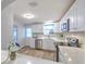 Updated kitchen featuring white cabinets, stainless steel appliances, and modern countertops at 1511 Meridel Ave, Tampa, FL 33612