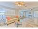 Inviting living room featuring stylish decor, modern ceiling fan, and wood-look floors at 1511 Meridel Ave, Tampa, FL 33612