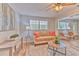 Comfortable living room showcasing neutral decor, updated flooring, and an open layout at 1511 Meridel Ave, Tampa, FL 33612