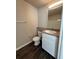 Bathroom features white vanity with solid surface counters, modern lighting, and ample storage at 1530 Villa Capri Cir # 302, Odessa, FL 33556