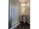 Bathroom featuring shower with glass doors and a white pedestal sink at 1530 Villa Capri Cir # 302, Odessa, FL 33556