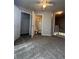 Open carpeted bedroom with a view of the closet and bathroom at 1530 Villa Capri Cir # 302, Odessa, FL 33556
