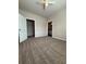 Spacious carpeted bedroom featuring neutral walls, ceiling fan, walk-in closet, and ensuite bath at 1530 Villa Capri Cir # 302, Odessa, FL 33556