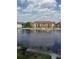 Scenic view of a community overlooking a lake with fountains and lush landscaping at 1530 Villa Capri Cir # 302, Odessa, FL 33556