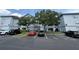 Inviting condo exterior featuring well-maintained landscaping and accessible parking at 1530 Villa Capri Cir # 302, Odessa, FL 33556