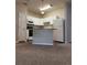 Modern kitchen with white cabinetry, a breakfast bar, and a full-sized refrigerator at 1530 Villa Capri Cir # 302, Odessa, FL 33556