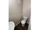 This half-bath boasts a toilet, basin, and modern fixtures, perfect for guests at 1530 Villa Capri Cir # 302, Odessa, FL 33556