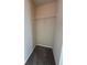 Walk-in closet features neutral walls and built-in shelving for optimal storage at 1530 Villa Capri Cir # 302, Odessa, FL 33556