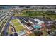 An aerial view showcasing Sun City Center amenities, including a pool, lawn bowling, and recreation facilities at 1823 Atrium Dr, Sun City Center, FL 33573