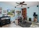 Bonus room featuring a drum set, window to the outside, and blue walls at 1823 Atrium Dr, Sun City Center, FL 33573