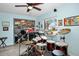 Bonus room features a drum set, window to the outside, and blue walls at 1823 Atrium Dr, Sun City Center, FL 33573
