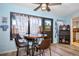 Cozy breakfast nook featuring a round table, three chairs, and lots of light at 1823 Atrium Dr, Sun City Center, FL 33573