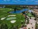 Scenic aerial view of the golf course, including a sparkling lake and lush green fairways at 1823 Atrium Dr, Sun City Center, FL 33573