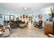 Comfortable living room with blue walls, ceiling fan, and open layout to kitchen at 1823 Atrium Dr, Sun City Center, FL 33573
