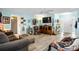 Cozy living room with neutral furniture and soft blue walls at 1823 Atrium Dr, Sun City Center, FL 33573