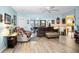 Bright living room featuring neutral furniture and an open concept layout at 1823 Atrium Dr, Sun City Center, FL 33573