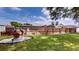 Beautifully landscaped backyard features a manicured lawn and decorative accents at 1849 Del Robles Dr, Clearwater, FL 33764